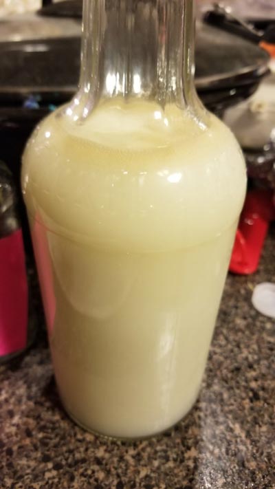 This 8-month everclear freezer tincture turned cloudy white after being watered down 2:1.